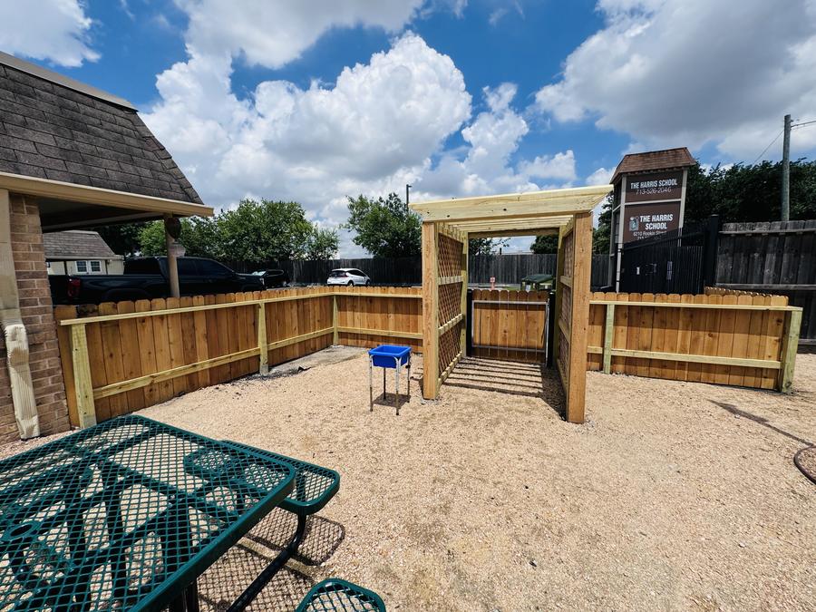 Wood screening and shade structure around a school courtyard