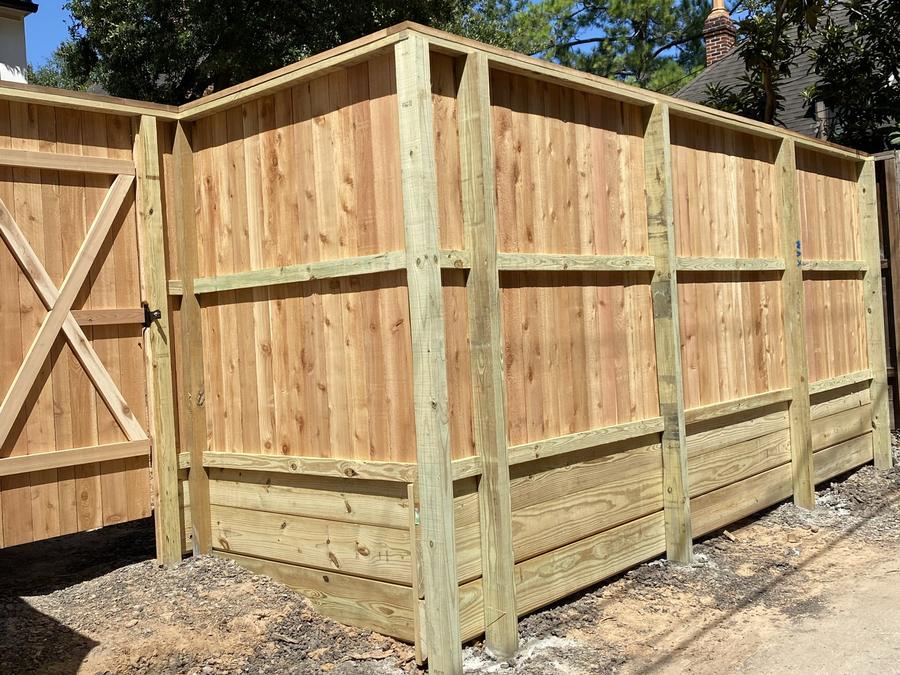 Heavy timber commercial dumpster enclosure with cross-braced gates